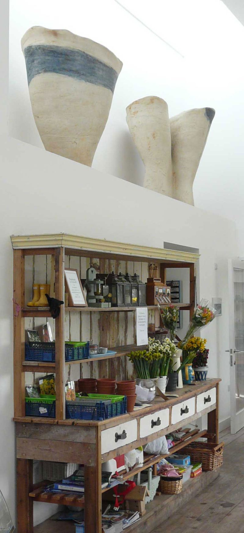 Tony Lattimer's works of 2000 high above the restaurant in Tremenheere Sculpture Garden