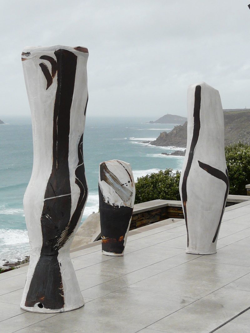 Three pieces of Tony Lattimer's work photographed overlooking the sea above Sennen, Cornwall