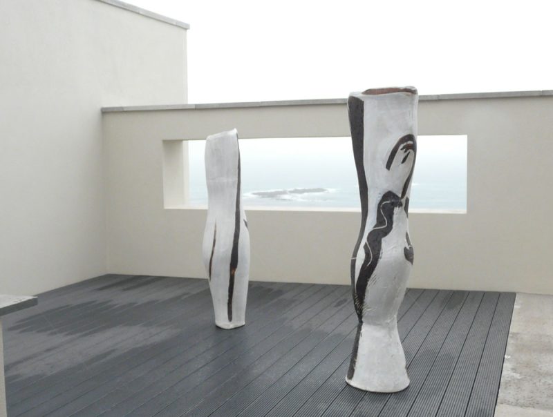 Two pieces of Tony Lattimer's work photographed overlooking the sea above Sennen, Cornwall