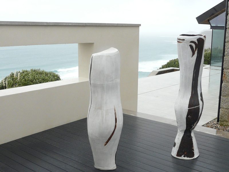 Two pieces of Tony Lattimer's work photographed overlooking the sea above Sennen, Cornwall
