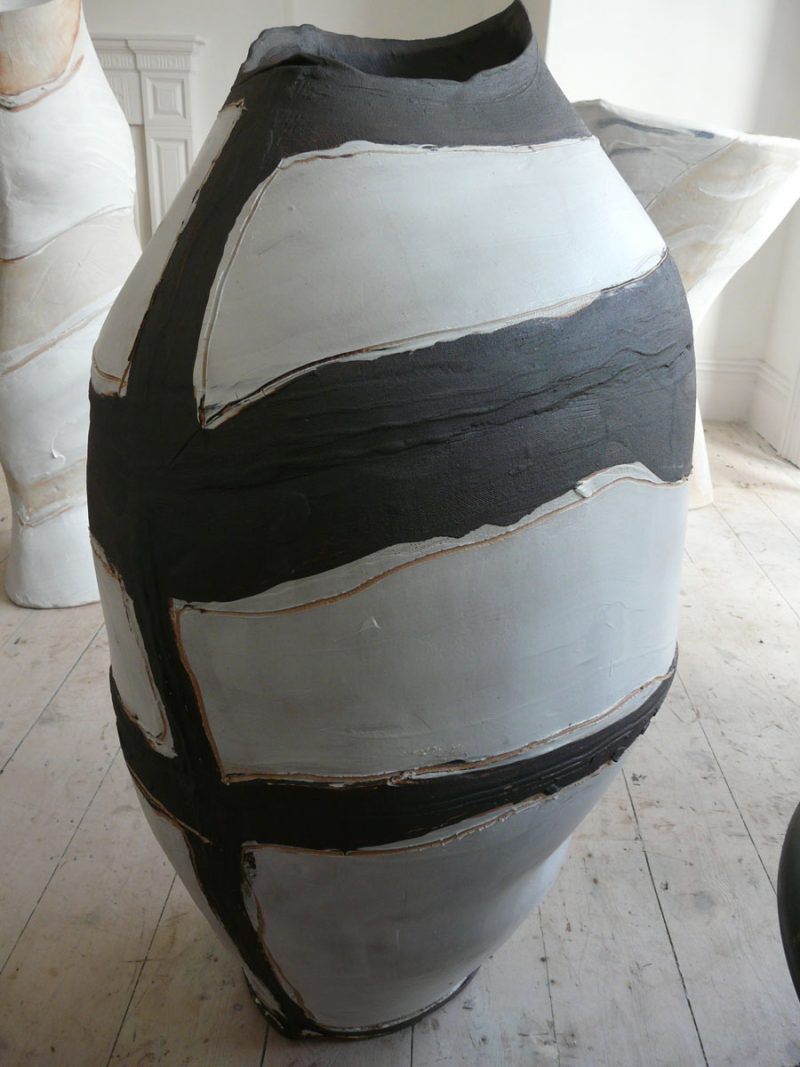 Casual markings of black slip with a white matt slip-glaze.
